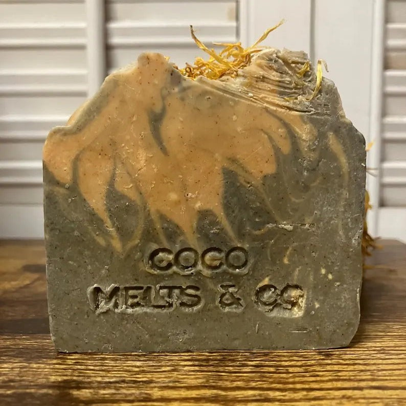 Handcrafted artisanal vegan soap bar made with turmeric, bamboo charcoal, apple cider vinegar, and rosemary essential oil, formulated with organic ingredients including shea butter, avocado oil, and cocoa butter for a natural, chemical-free skincare experience.