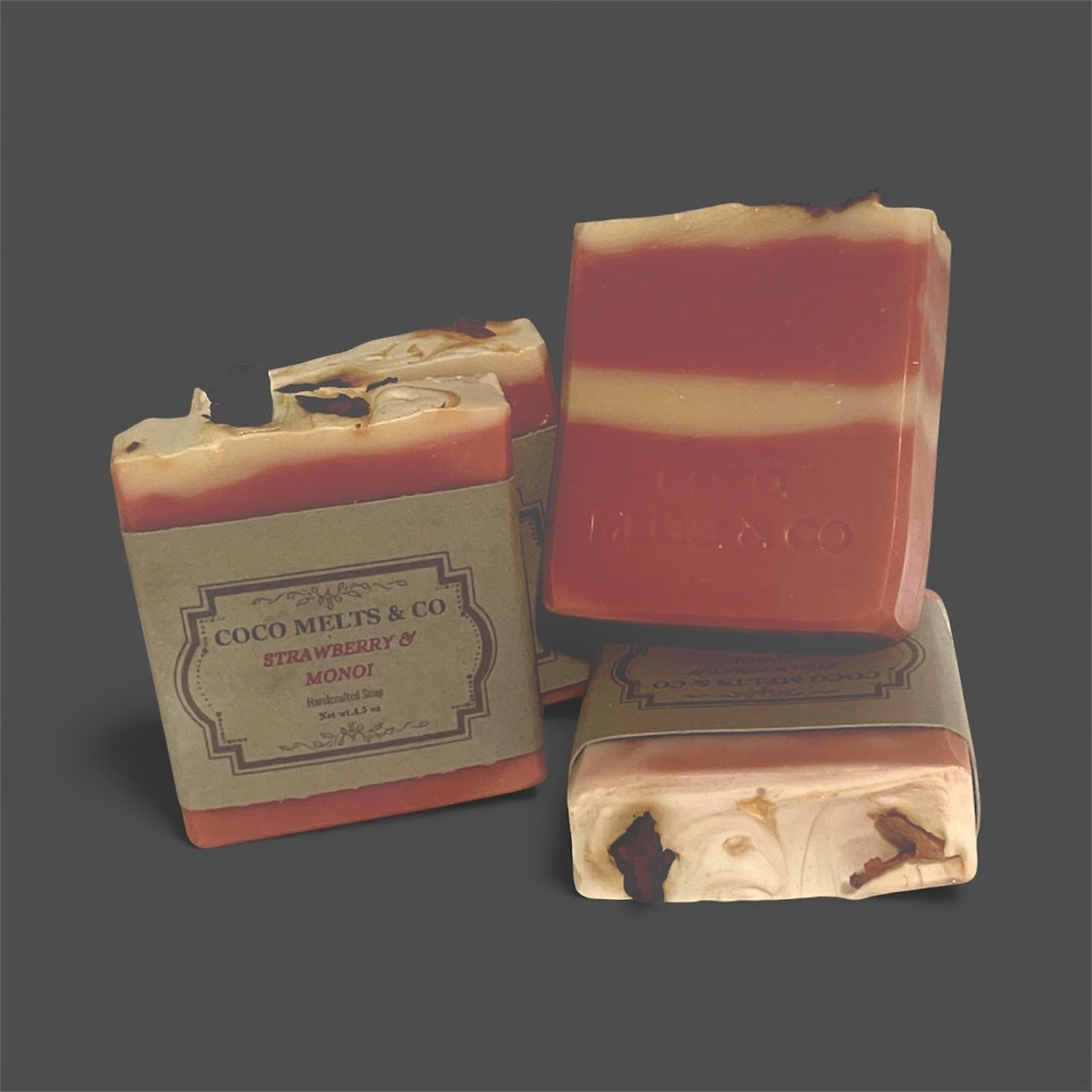 Natural goat milk bar soap with strawberry and Tahitian monoi essential oils, rose petals, and kaolin clay for moisturized, soft skin