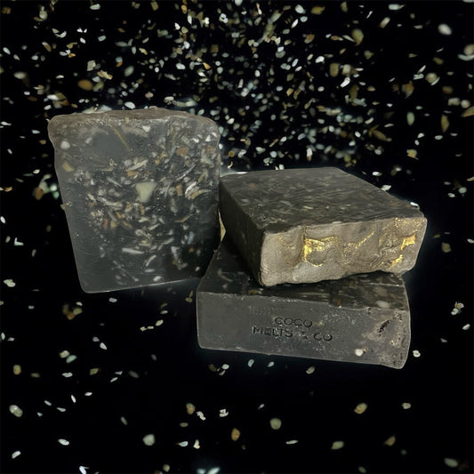 Handcrafted zero-waste recycled Castile soap bar with colorful confetti soap trimmings set against a dark activated charcoal base, fragrance-free and eco-friendly artisan bar soap